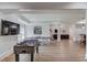 Finished basement with recreational area, bar seating, lounge with leather sofa, and lots of space at 5394 Brendlynn Dr, Suwanee, GA 30024