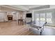 Basement with a ping pong table, foosball table, stone fireplace, media, and tons of space to play at 5394 Brendlynn Dr, Suwanee, GA 30024