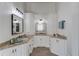 Bathroom featuring granite countertop, sink, mirror, towel and white cabinetry at 5394 Brendlynn Dr, Suwanee, GA 30024