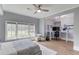 Bright bedroom featuring an adjacent office space with a large window at 5394 Brendlynn Dr, Suwanee, GA 30024