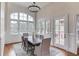 Sun-filled dining area with large windows and access to an outdoor patio at 5394 Brendlynn Dr, Suwanee, GA 30024