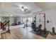 Home gym with a full-length mirror, weight rack, and elliptical machine for your exercise needs at 5394 Brendlynn Dr, Suwanee, GA 30024