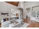 Open-concept living room with vaulted ceiling, hardwood floors, and modern decor at 5394 Brendlynn Dr, Suwanee, GA 30024