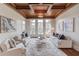 Inviting living room with coffered wood ceilings, hardwood floors, and an abundance of natural light at 5394 Brendlynn Dr, Suwanee, GA 30024