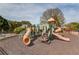 Community playground featuring slides, climbing structures, and ample space for to enjoy at 5394 Brendlynn Dr, Suwanee, GA 30024