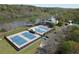Aerial view featuring tennis courts, river, clubhouse, parking and landscaping with trees at 85 Cliffside Crossing, Atlanta, GA 30350