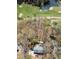 Aerial view of a house situated next to a golf course and pond surrounded by mature trees at 85 Cliffside Crossing, Atlanta, GA 30350