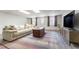 Comfortable basement with a stylish rug, a plush couch, and a large television for relaxation at 85 Cliffside Crossing, Atlanta, GA 30350