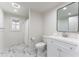 Modern bathroom featuring marble floors, a vanity sink, and a shower behind a curtain at 85 Cliffside Crossing, Atlanta, GA 30350