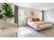 Bedroom featuring gray walls, hardwood floors, and decorative pillows and a large plant at 85 Cliffside Crossing, Atlanta, GA 30350