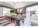 Well-lit dining room with a large table, hardwood floors, and a view through doorways to other rooms at 85 Cliffside Crossing, Atlanta, GA 30350