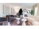 Stylish living room with a black grand piano, neutral furniture, modern decor, and hardwood floors at 85 Cliffside Crossing, Atlanta, GA 30350