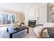 Inviting living room with a fireplace, large windows, built-in shelving, and comfortable seating at 85 Cliffside Crossing, Atlanta, GA 30350