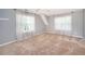 This sunny bedroom has neutral walls, lots of natural light, and neutral carpeting at 1107 Fieldstone Dr, Canton, GA 30114