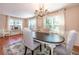 Open dining area featuring a chandelier, large windows, and easy access to other living spaces at 1107 Fieldstone Dr, Canton, GA 30114