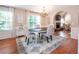 Inviting dining space featuring a decorative chandelier and adjacent living room with a fireplace at 1107 Fieldstone Dr, Canton, GA 30114