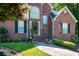 Beautiful brick home with a welcoming front entrance and manicured lawn at 1107 Fieldstone Dr, Canton, GA 30114