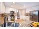 Spacious kitchen with granite countertops, stainless steel appliances, and bright white cabinetry at 1107 Fieldstone Dr, Canton, GA 30114