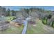 An aerial view of a charming house with mature landscaping and a winding driveway at 1880 Ridgedale Dr, Snellville, GA 30078