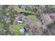 A sprawling estate with multiple buildings, lush gardens, and mature trees at 1880 Ridgedale Dr, Snellville, GA 30078