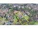 An aerial view showing the house and property outlined in yellow near mature landscaping at 1880 Ridgedale Dr, Snellville, GA 30078