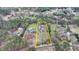 Estate aerial view with house outlined in yellow highlighting the expansive lot with mature landscaping at 1880 Ridgedale Dr, Snellville, GA 30078