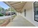 Open-air back porch with ceiling fans, providing a relaxing outdoor space at 1880 Ridgedale Dr, Snellville, GA 30078