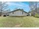 The property features a large, grassy backyard with a shed and space for outdoor activities at 1880 Ridgedale Dr, Snellville, GA 30078