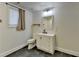 Bathroom featuring a white vanity, tile floor and modern fixtures at 1880 Ridgedale Dr, Snellville, GA 30078