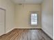 Neutral bedroom with hard surface floors, base trim, window and natural lighting at 1880 Ridgedale Dr, Snellville, GA 30078