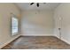 Empty bedroom with wooden floors, white walls, a window and neutral decor at 1880 Ridgedale Dr, Snellville, GA 30078