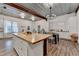 Spacious kitchen features a butcher block island, white cabinets, and a dining area at 1880 Ridgedale Dr, Snellville, GA 30078