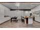 Bright and airy kitchen with an island, stainless appliances, dining table, and white cabinetry at 1880 Ridgedale Dr, Snellville, GA 30078