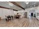 Spacious open concept living area with dining and kitchen featuring laminate floors and natural lighting at 1880 Ridgedale Dr, Snellville, GA 30078
