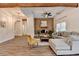 Bright living room featuring a statement wood wall, hardwood floors, comfortable seating, and modern lighting at 1880 Ridgedale Dr, Snellville, GA 30078