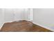 Bedroom featuring new laminate flooring, with a white door leading to a hallway at 2297 Sheryl Dr, Decatur, GA 30032