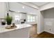 Stylish kitchen featuring modern appliances and hardwood floors, with a view into the dining area at 2297 Sheryl Dr, Decatur, GA 30032
