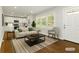 Inviting living area with hardwood floors and a view of the updated kitchen at 2297 Sheryl Dr, Decatur, GA 30032