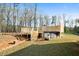 Backyard with a wooden deck above the above ground pool, great for outdoor entertaining and relaxation at 338 Rc Thompson Rd, Dallas, GA 30157