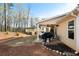 Cozy covered patio with outdoor seating, grill, and a view of the backyard, ideal for relaxing and entertaining at 338 Rc Thompson Rd, Dallas, GA 30157