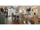 Well-lit dining room featuring hardwood floors, chandelier, and access to the outdoor patio at 338 Rc Thompson Rd, Dallas, GA 30157