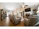 Inviting living room featuring a stone fireplace, hardwood floors, and vaulted ceilings at 338 Rc Thompson Rd, Dallas, GA 30157