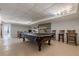 This finished basement features a pool table and an adjacent entertainment area with plenty of room at 5215 Silver Creek Dr, Lilburn, GA 30047