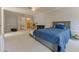 This bedroom features a blue bed with a daybed and is accented with neutral paint and carpeting at 5215 Silver Creek Dr, Lilburn, GA 30047