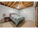Bedroom with exposed ceilings, standard closet, an exposed ceiling fan, and an ensuite bathroom at 5215 Silver Creek Dr, Lilburn, GA 30047