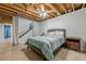 Bedroom featuring exposed ceilings, standard closet, and a ceiling fan at 5215 Silver Creek Dr, Lilburn, GA 30047