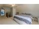 Upstairs bedroom with a sloped ceiling, carpet, ceiling fan, and ensuite bathroom at 5215 Silver Creek Dr, Lilburn, GA 30047