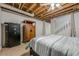 Bedroom with exposed ceilings, walk-in closet, security safe, armoire, and a ceiling fan at 5215 Silver Creek Dr, Lilburn, GA 30047