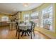 Cozy breakfast nook with ample windows, connected to the kitchen, creating a welcoming dining space at 5215 Silver Creek Dr, Lilburn, GA 30047