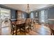 Chic dining room with hardwood floors and a crystal chandelier at 5215 Silver Creek Dr, Lilburn, GA 30047